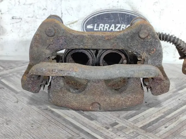 Суппорт тормозной передний левый DISCOVERY 3 L319