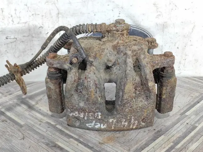 Суппорт тормозной передний левый DISCOVERY 3 L319