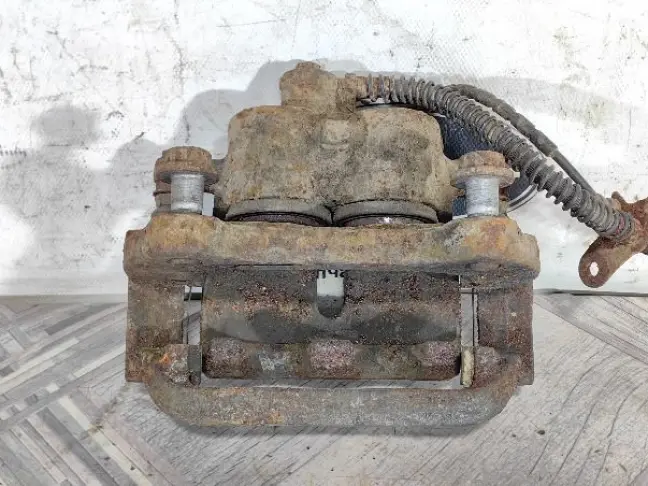 Суппорт тормозной передний левый DISCOVERY 3 L319