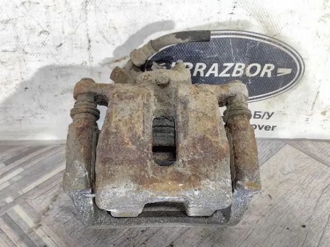 Суппорт тормозной задний правый DISCOVERY 3 L319