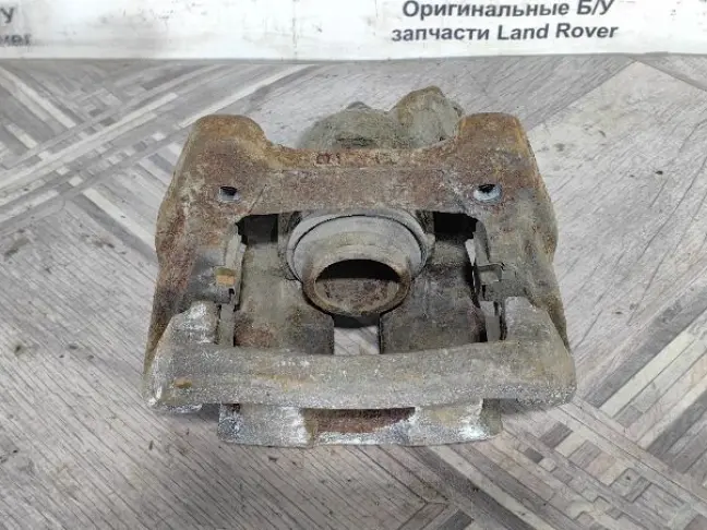 Суппорт тормозной задний правый DISCOVERY 3 L319