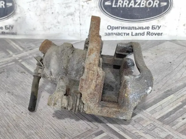 Суппорт тормозной задний правый DISCOVERY 3 L319