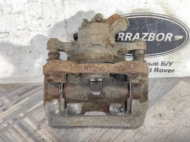 Суппорт тормозной задний правый DISCOVERY 3 L319