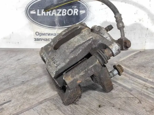 Суппорт тормозной задний левый DISCOVERY 3 L319