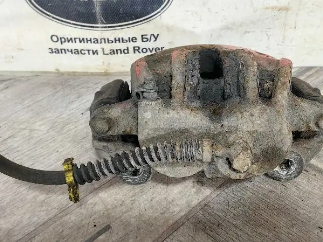 Суппорт тормозной передний правый DISCOVERY 3 L319