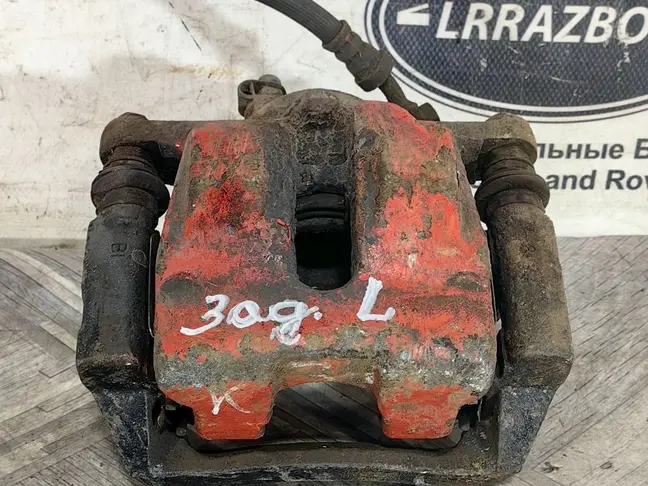 Суппорт тормозной задний левый DISCOVERY 3 L319