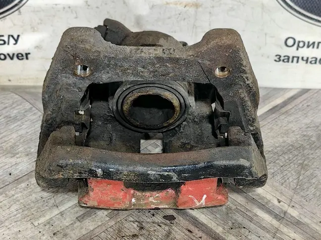 Суппорт тормозной задний левый DISCOVERY 3 L319