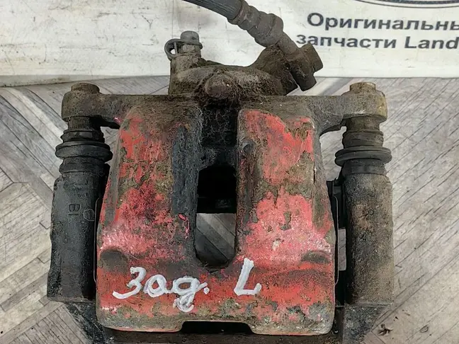 Суппорт тормозной задний левый DISCOVERY 3 L319