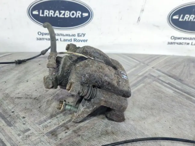 Суппорт тормозной задний правый DISCOVERY 3 L319