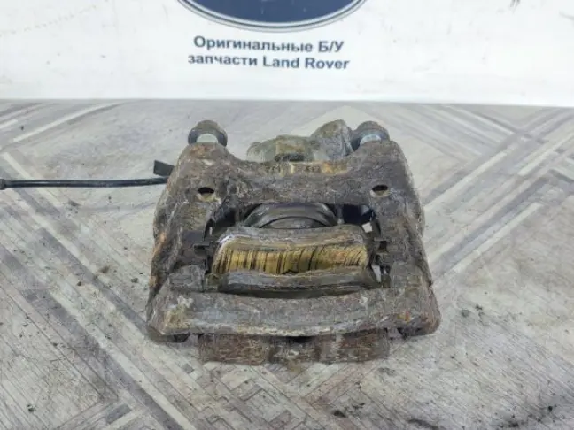 Суппорт тормозной задний правый DISCOVERY 3 L319