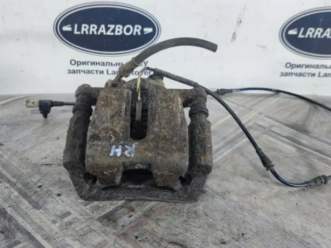 Суппорт тормозной задний правый DISCOVERY 3 L319