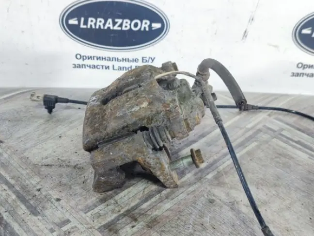 Суппорт тормозной задний правый DISCOVERY 3 L319