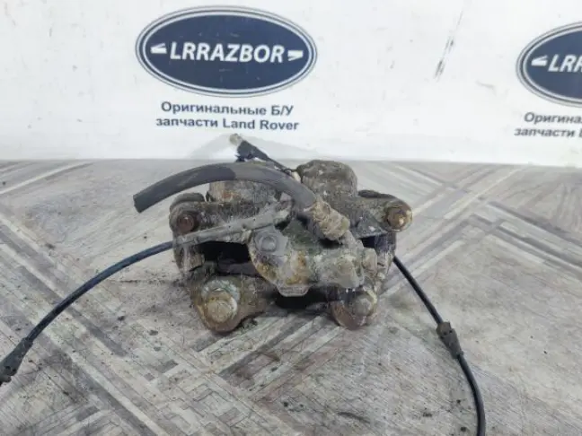 Суппорт тормозной задний правый DISCOVERY 3 L319