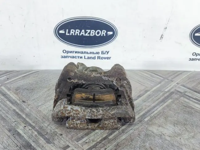 Суппорт тормозной задний левый DISCOVERY 3 L319