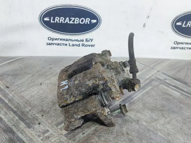 Суппорт тормозной задний левый DISCOVERY 3 L319