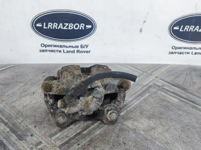 Суппорт тормозной задний левый DISCOVERY 3 L319