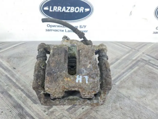 Суппорт тормозной задний левый DISCOVERY 3 L319