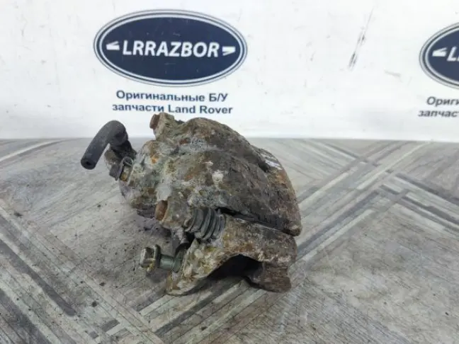 Суппорт тормозной задний левый DISCOVERY 3 L319
