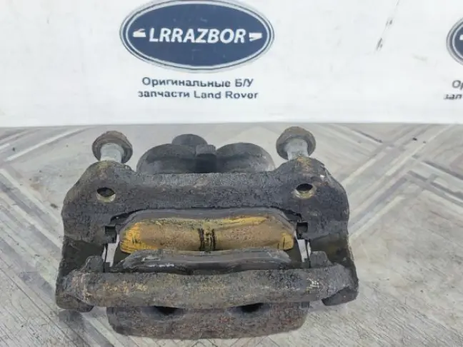 Суппорт тормозной передний левый DISCOVERY 3 L319