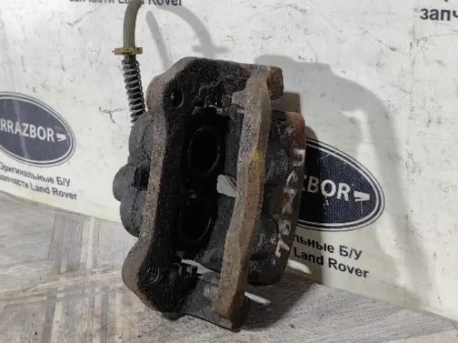 Суппорт тормозной передний левый DISCOVERY 3 L319