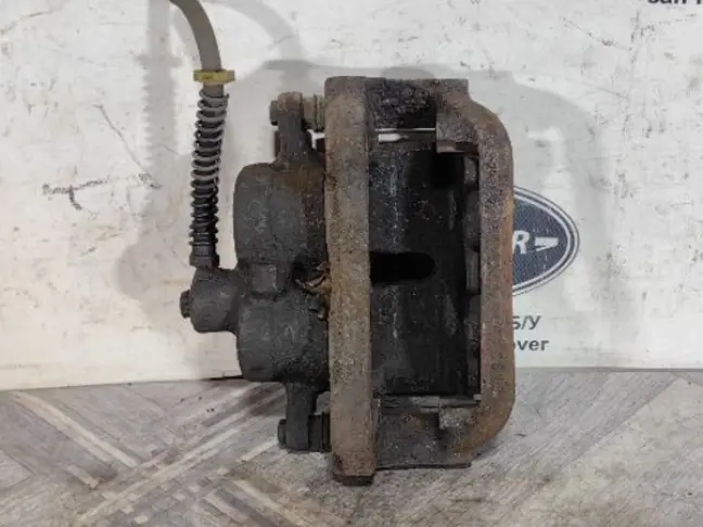 Суппорт тормозной передний левый DISCOVERY 3 L319