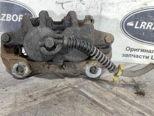 Суппорт тормозной передний левый DISCOVERY 3 L319