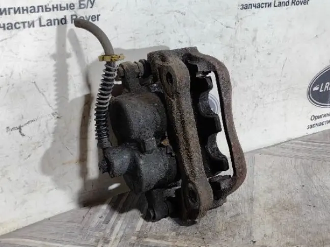 Суппорт тормозной передний левый DISCOVERY 3 L319