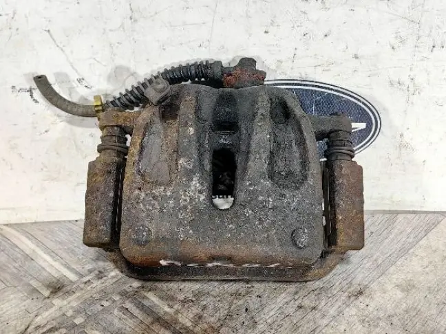 Суппорт тормозной передний левый DISCOVERY 3 L319