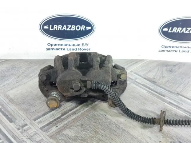 Суппорт тормозной передний левый DISCOVERY 3 L319