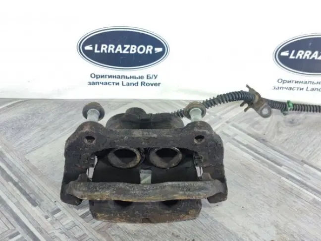 Суппорт тормозной передний левый DISCOVERY 3 L319