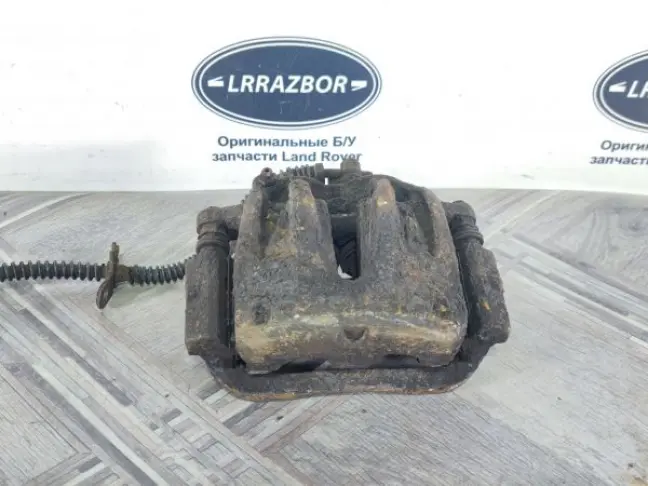Суппорт тормозной передний левый DISCOVERY 3 L319