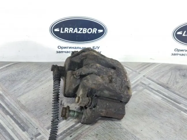 Суппорт тормозной передний левый DISCOVERY 3 L319