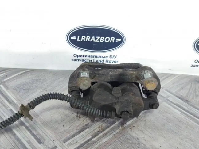 Суппорт тормозной передний левый DISCOVERY 3 L319