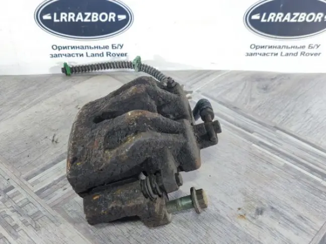 Суппорт тормозной передний левый DISCOVERY 3 L319