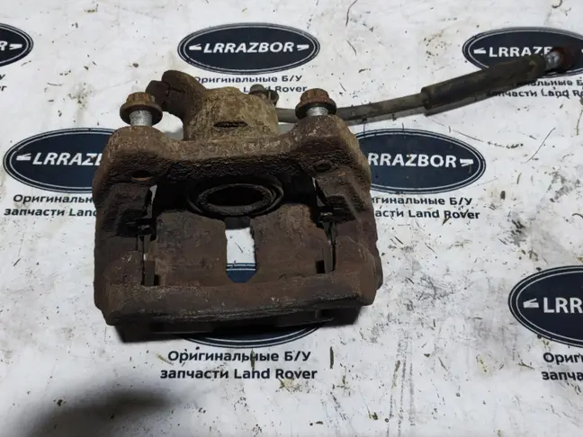 Суппорт тормозной задний левый DISCOVERY 3 L319