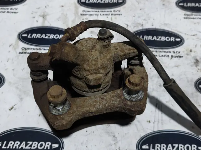 Суппорт тормозной задний левый DISCOVERY 3 L319