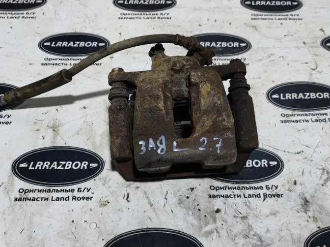 Суппорт тормозной задний левый DISCOVERY 3 L319